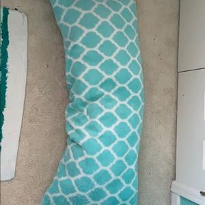 A gently used but washable teal body pillow